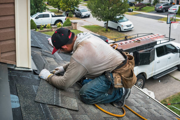 Professional Roof Replacement technician working in Wellington, KS